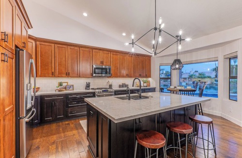 Crystal Shores House | Val Vista Lakefront Gem, Game Room, Htd Pool, Patio TV, Fire Pit, Kayaks, Bikes