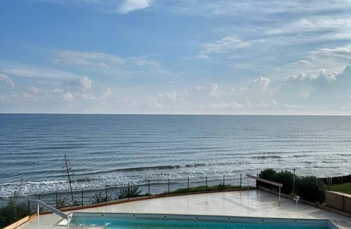 San-Nicolao Apartment | Waterfront apartment with pool and private beach access.