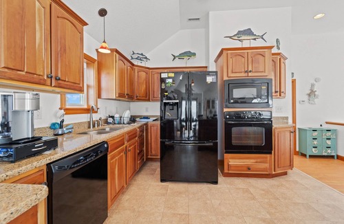 Frisco House | Waterfront home with boat dock, shared pool, & balcony with ocean view