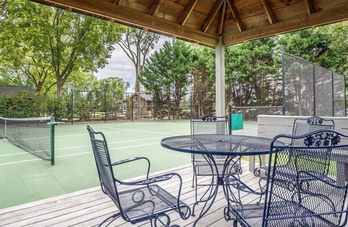 Dogue House | Waterfront home with swimming pool and tennis court.