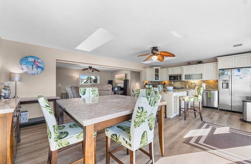 Cudjoe Gardens House | Waterfront home with a large dock, pool, and deck area. Can accommodate pets.