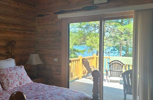 Kalispell House | Waterfront w/ Water Slide, Rock Climbing Wall & Ice Fishing Shanty in Winter