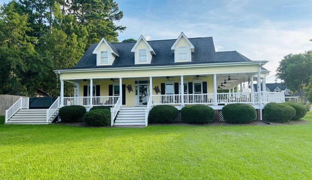A lovely 3-bed/3.5 bath home with a water view and in-ground pool on Pages Creek