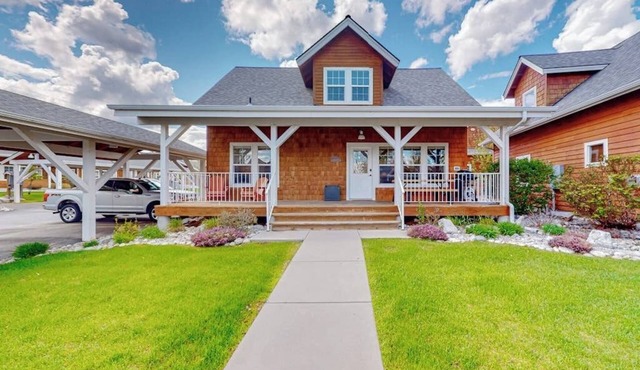 Adorable, two-story home with a furnished front porch, fireplace, & washer/dryer
