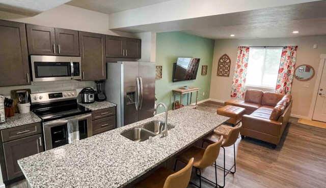 Central 3/2, garage, private yard, walk to arena, EV charger