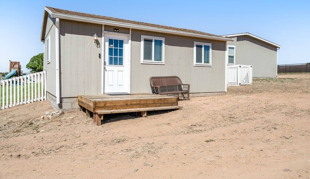 Cozy guest house with AC, WiFi, shared yard, playground, & amazing views