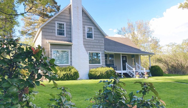 Cozy restored farmhouse on the river! Hot tub, wildlife, trails!