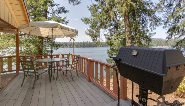 Dog-friendly lakefront cabin with water-view deck, gas grill, & private dock