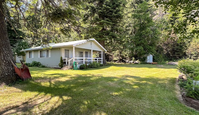 Lakefront home with private dock, large yard, wood stove, firepit, grill, W/D
