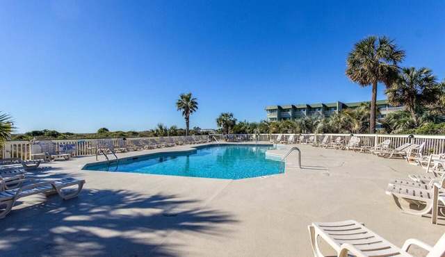 Oceanfront condo with water views, pool, balcony, & easy beach access