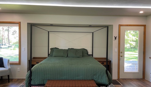 Relax and unwind while taking in nature on 5 acres in the pines with creeks!