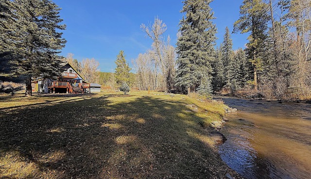 Riverfront Escape with Large Yard & Relaxing Deck Views