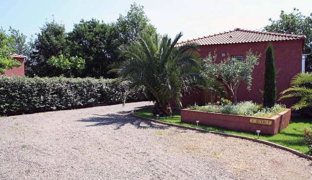 Villa in private seaside residence in shady park.